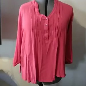 A crepey like shirt in salmon.